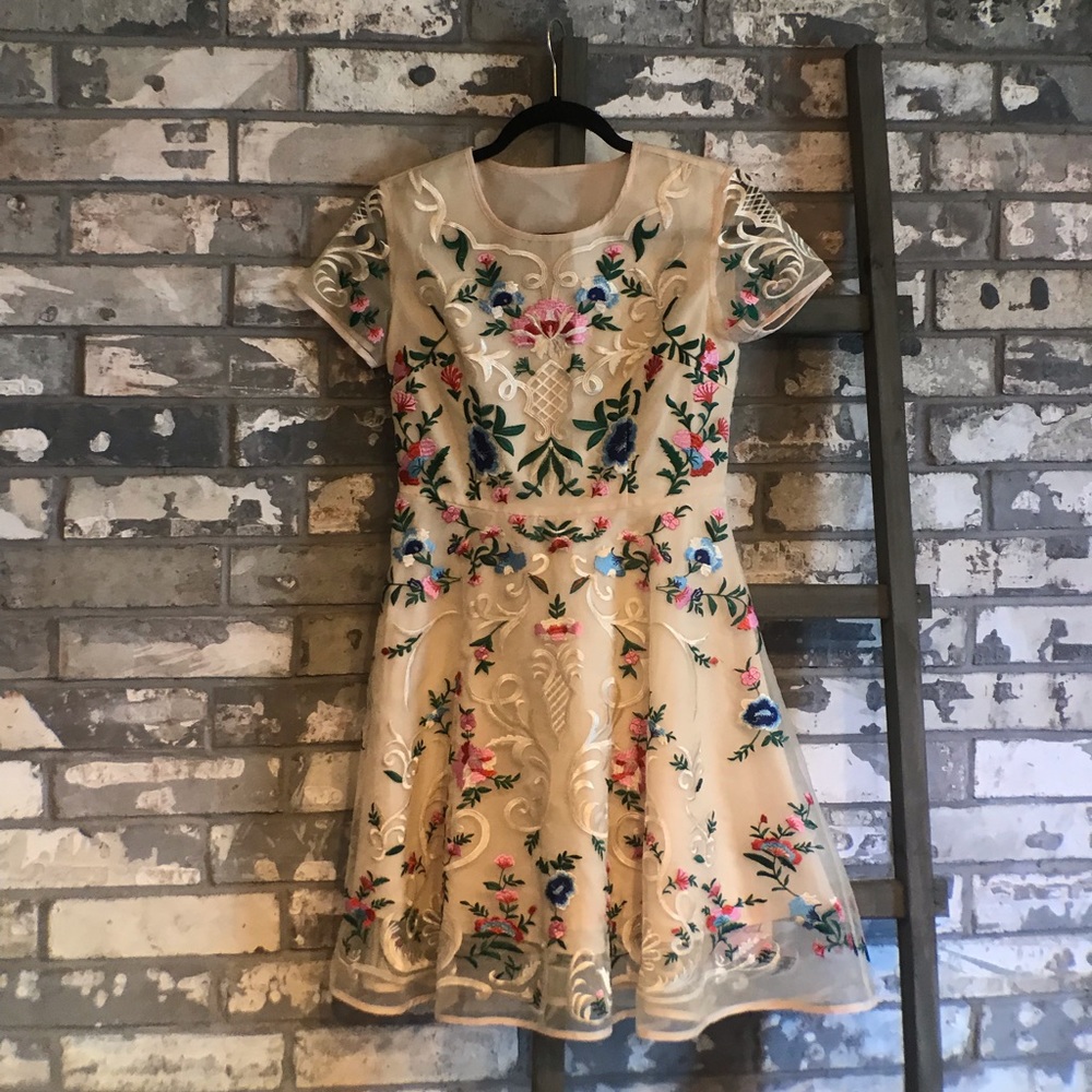 Cream Dress with floral detail.